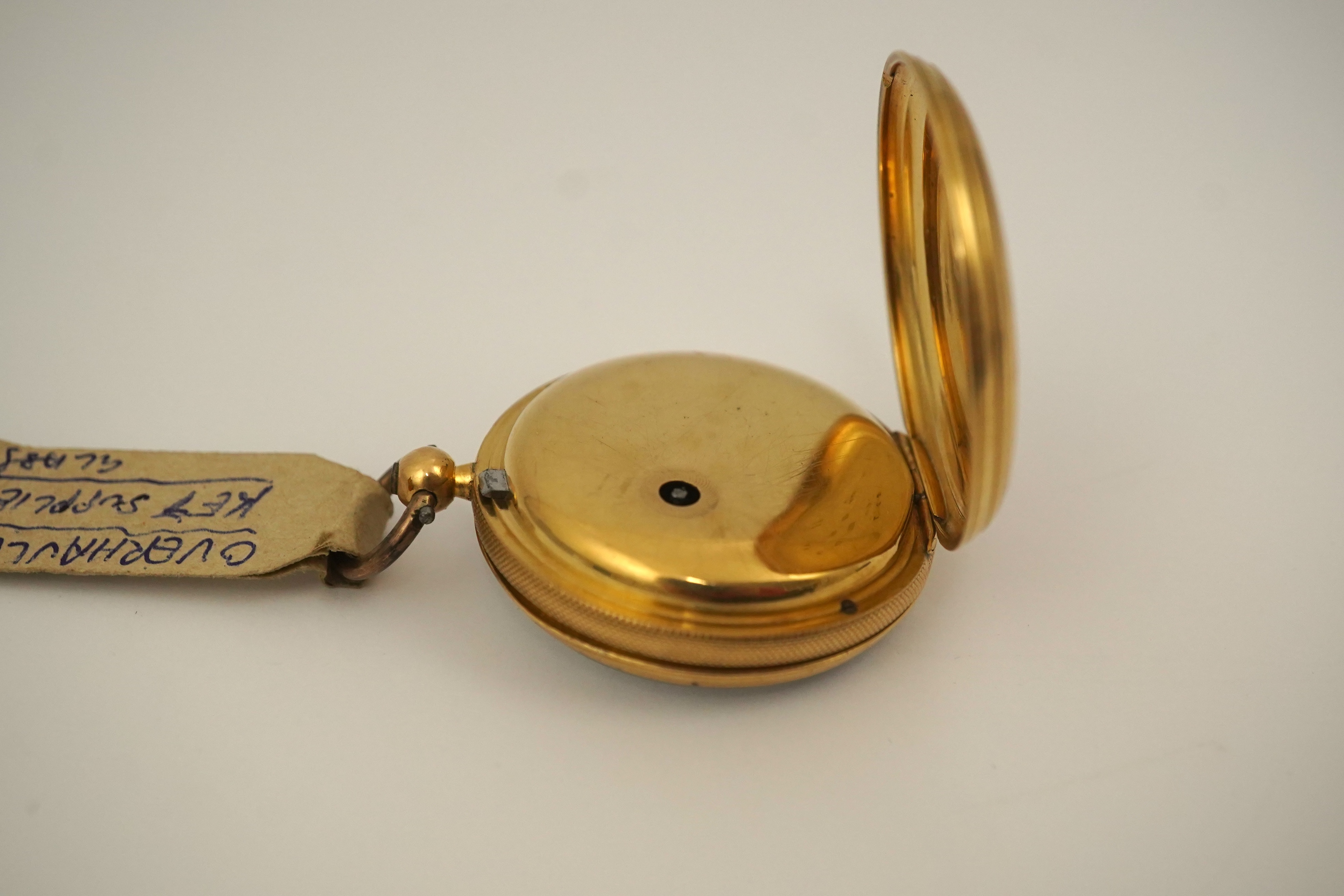 A Victorian engine turned 18ct gold open faced key wind fob watch